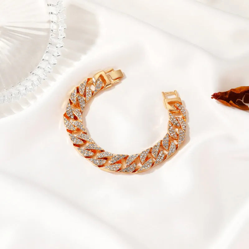 Gold Cuban flat buckle bracelet with crystal rhinestones on wrist, 15mm wide, 8 inch length