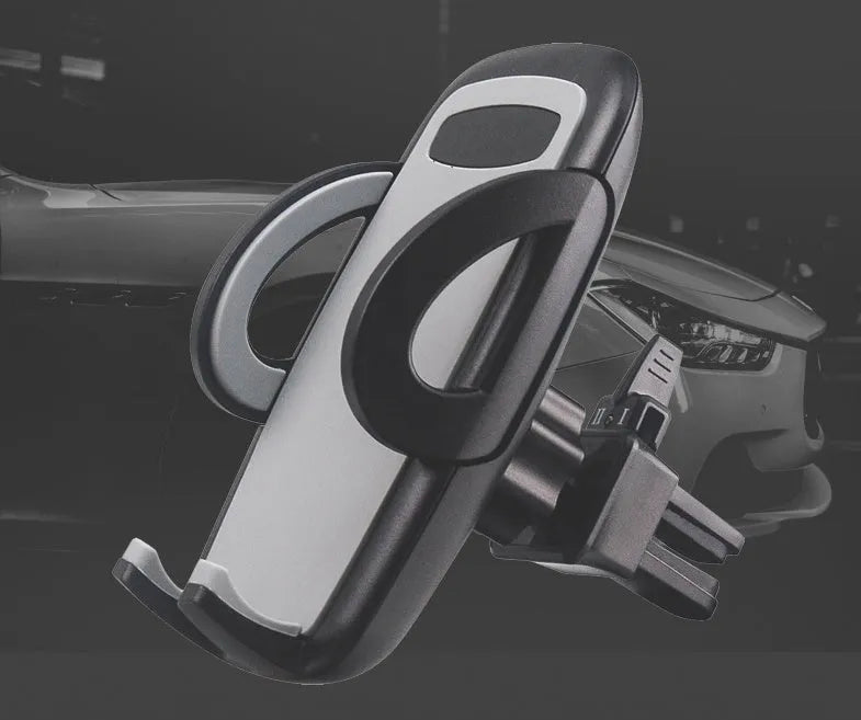 Black universal mobile phone holder attached to a car air conditioning vent.