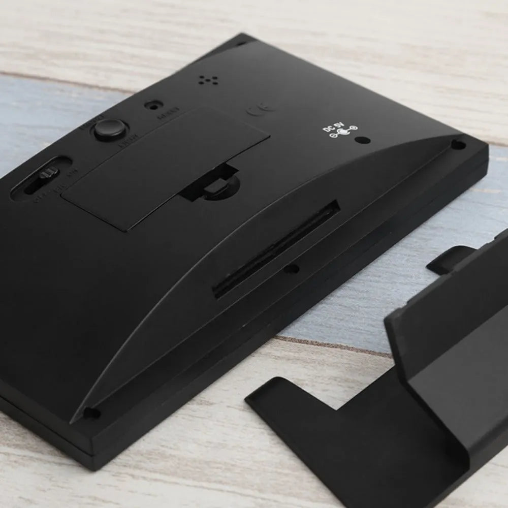 Multi-function large screen perpetual calendar clock with time, date, temperature, world time, alarm, and voice-activated backlight in Black