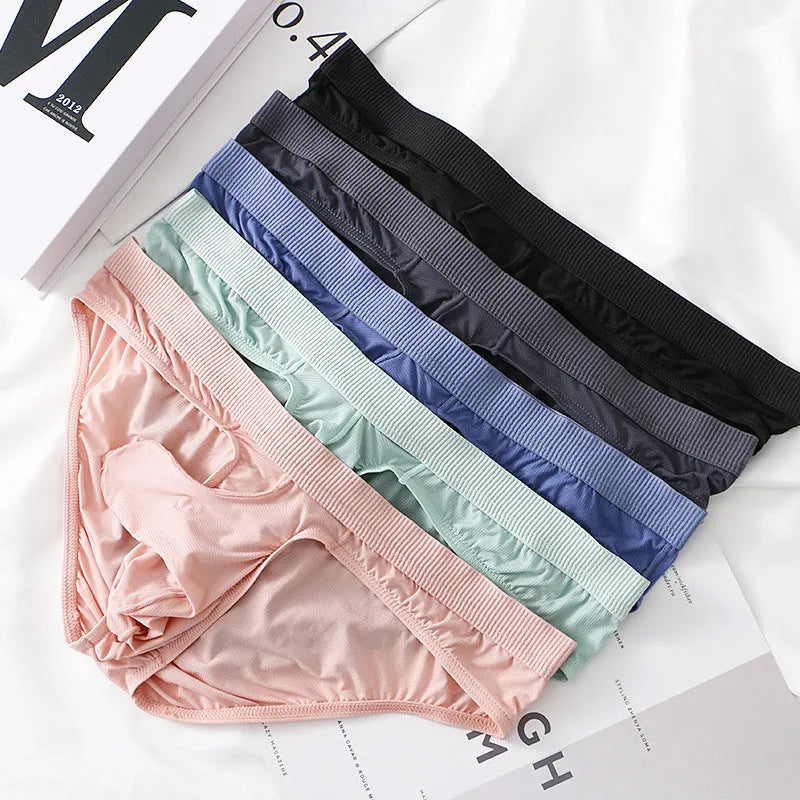 Men's low waist briefs underwear in Ice Silk fabric on a colour swatch showing black, grey, purple blue, light green, and pink.