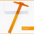 Transparent plastic T-shaped ruler with measurement scales for student design work