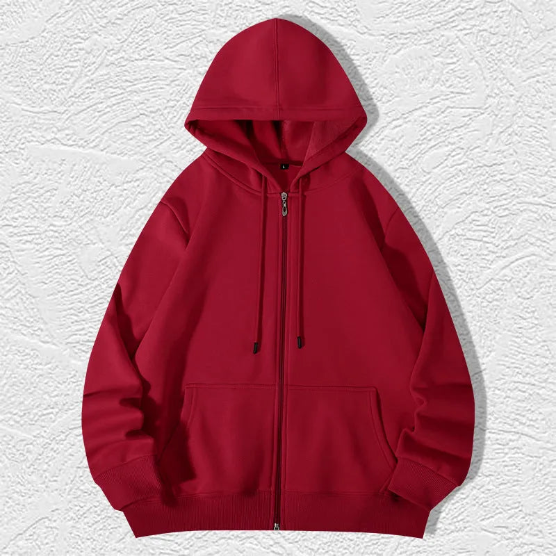 Man wearing a beige heavyweight cotton zip-up hooded cardigan with top-stitched pockets.