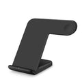 Black wireless phone charger with silicone surface measuring 140x121x105mm