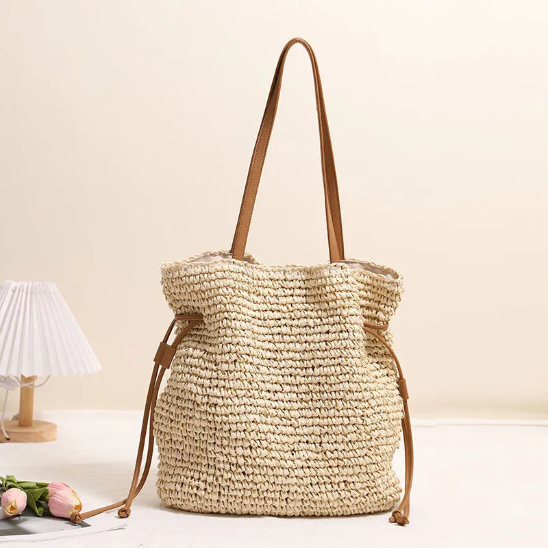 Large capacity paper straw drawstring shoulder bag in beige with double straps and inner pocket