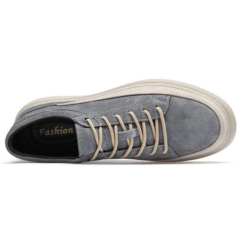 Men's grey pigskin leather casual skate shoes with flat rubber sole and lace-up front.