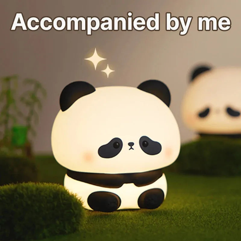 Panda LED night light with soft silicone head and colourful glow on a wooden table