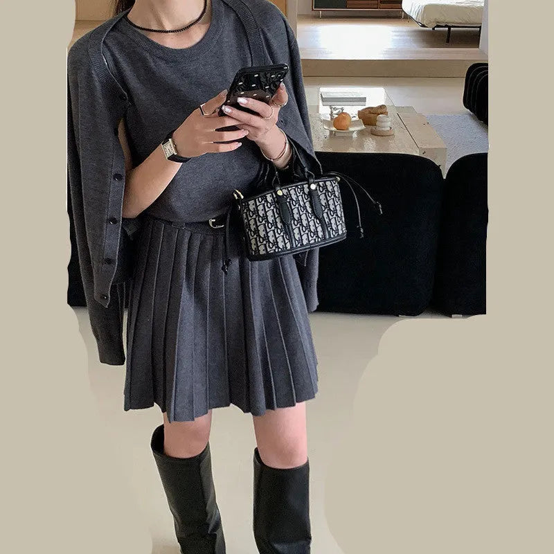 Women's grey art retro knitted vest skirt and cardigan two-piece set with 3D pattern.