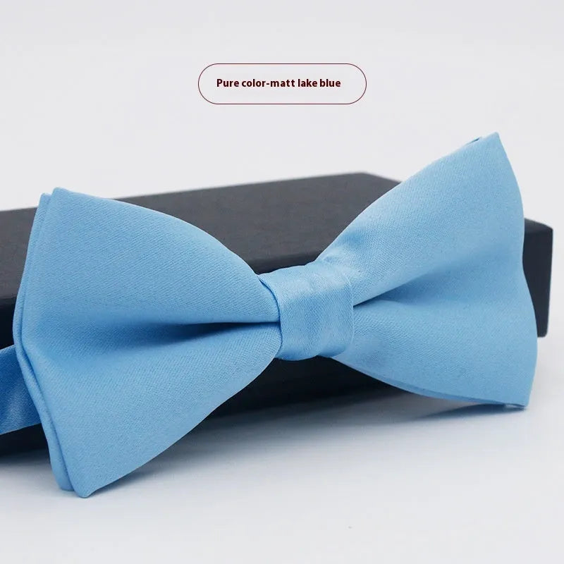 Solid colour flat head bow tie for formal wear in multiple colours including black, red, and blue.