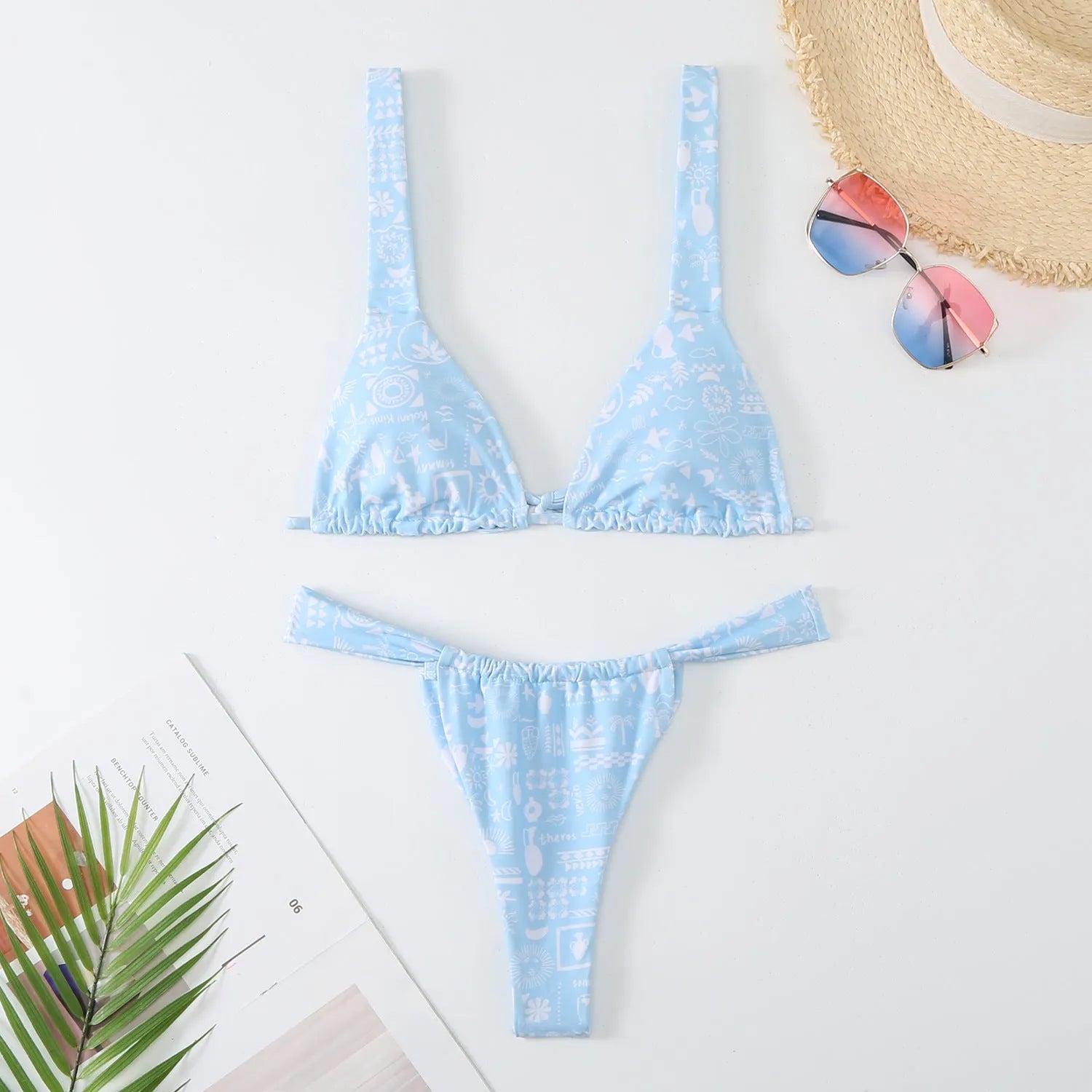 Women's floral print bikini swimsuit in blue, rose red, sky blue, or white colour.