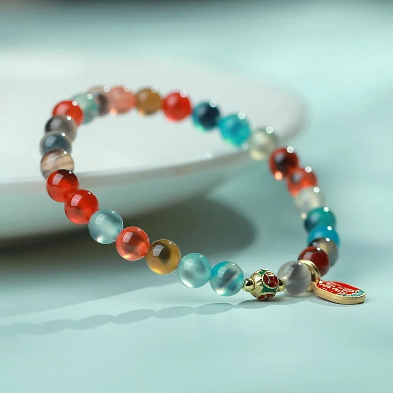 Women's agate bracelet with copper coin snake chain and coloured glaze detailing in geometric bead design
