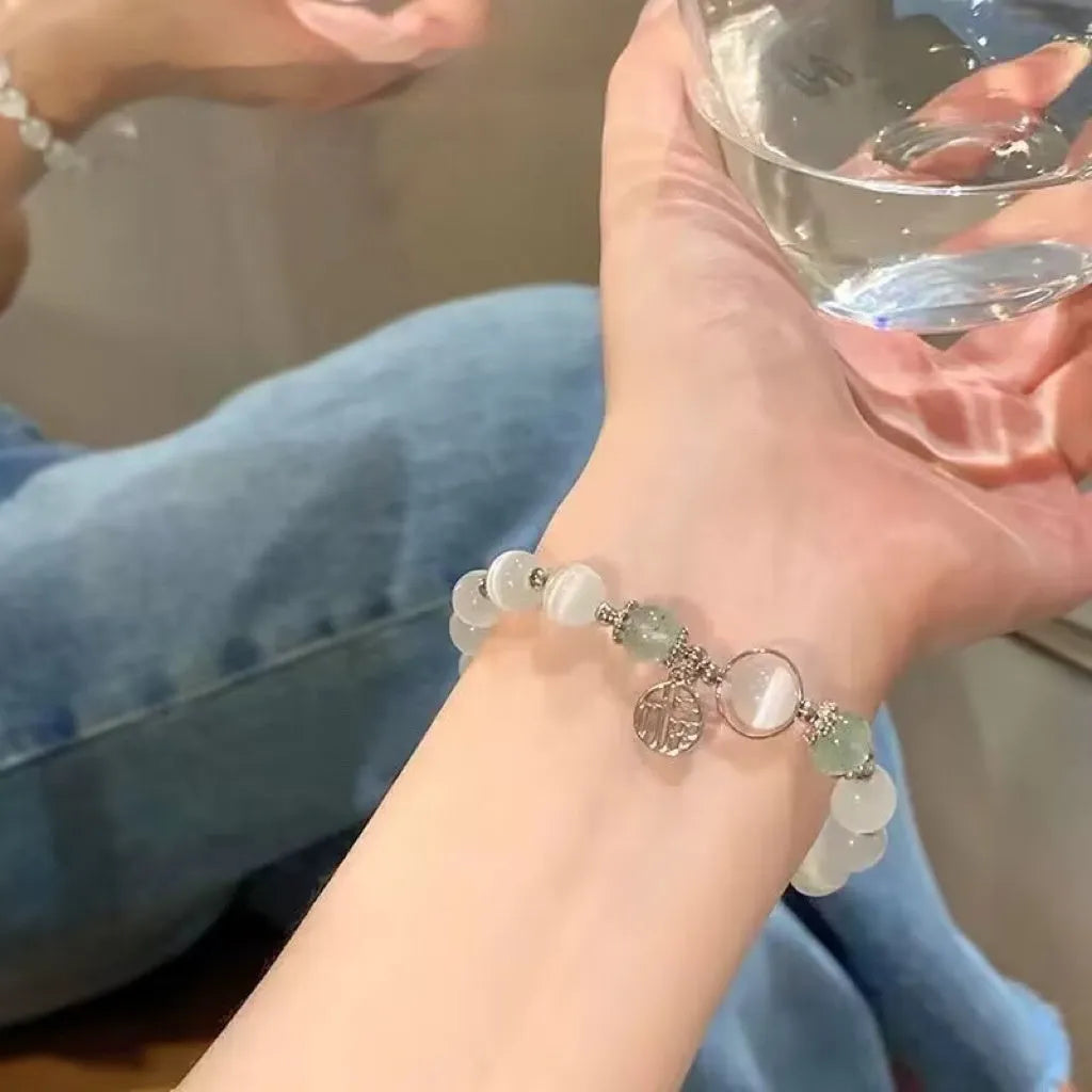 Glass butterfly bracelet for women with colour-coordinated beads in drop-shaped design