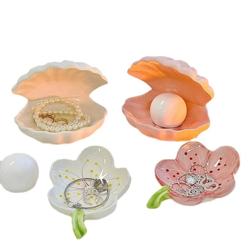 White porcelain decorative tray with optional small night light, shown in pink and yellow colour options.