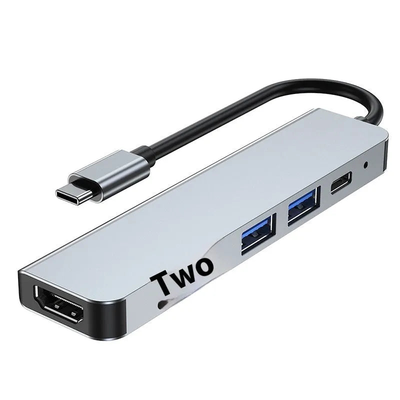 Portable six-in-one USB-C expansion dock with 100W charging capability for laptops and tablets