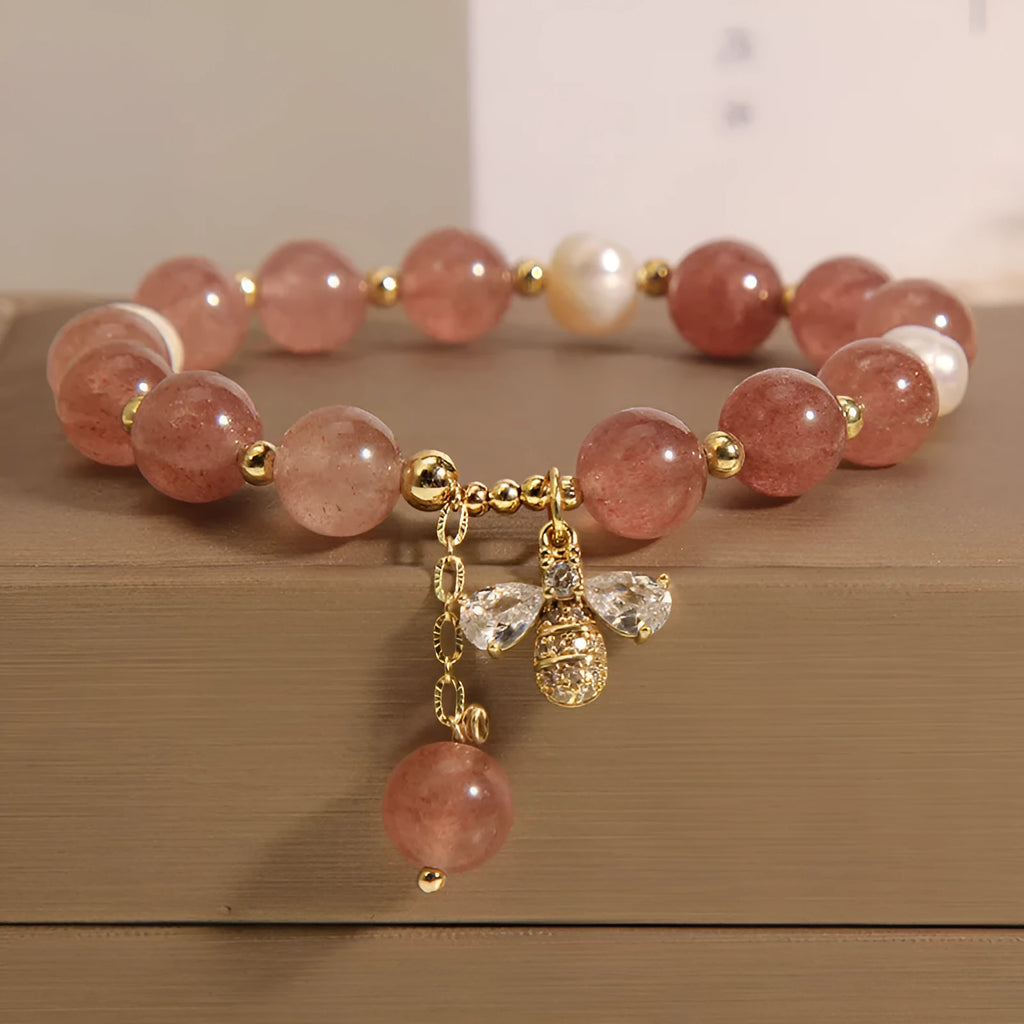 Women's bracelet with freshwater pearls, strawberry quartz stones, zircon accents and alloy bee charm