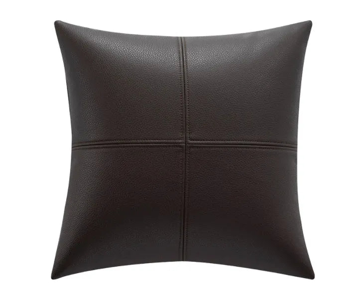 Simple solid colour cowhide leather pillow cover on a sofa, shown in a beige white colour.