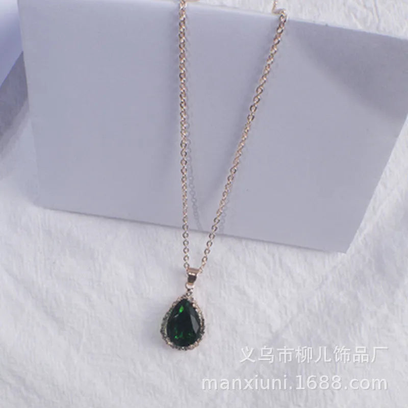 Rose gold geometric drop necklace with rhinestone details in pink colour option