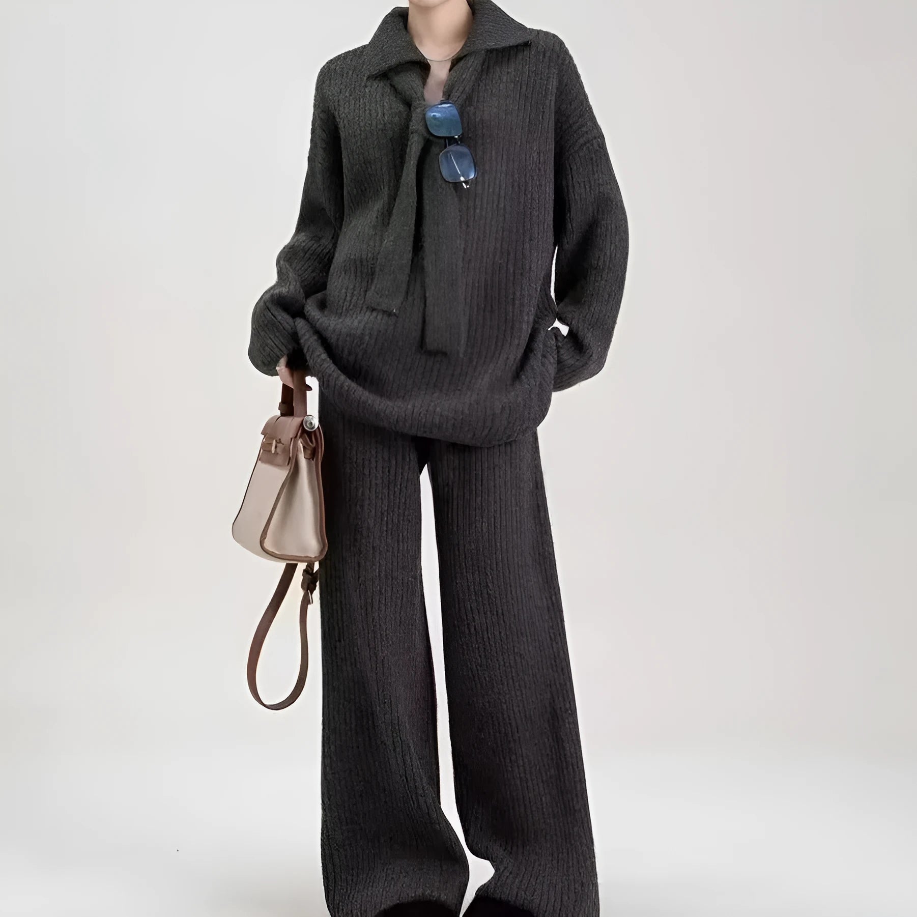 Ladies elegant knit sweater suit two-piece set in imitation cashmere, showing top and trousers in beige.