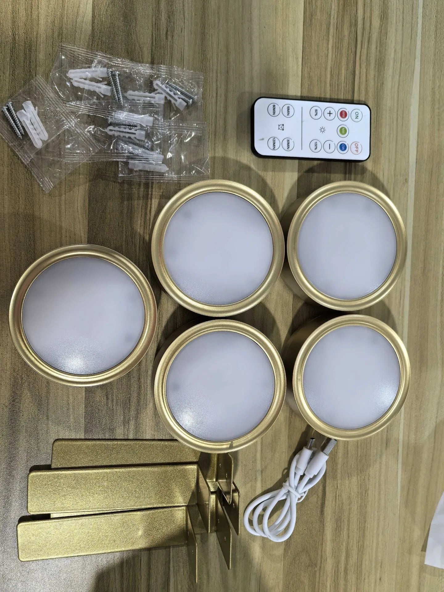 Wireless LED painting lamp with a magnetic mounting belt and remote control in black finish.