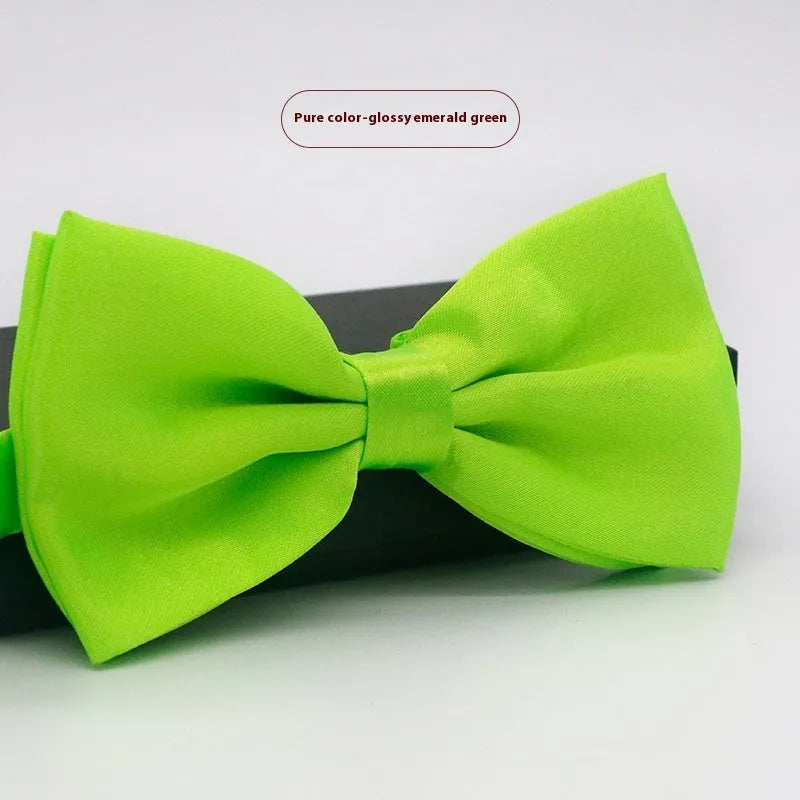 Solid colour flat head bow tie for formal wear in multiple colours including black, red, and blue.