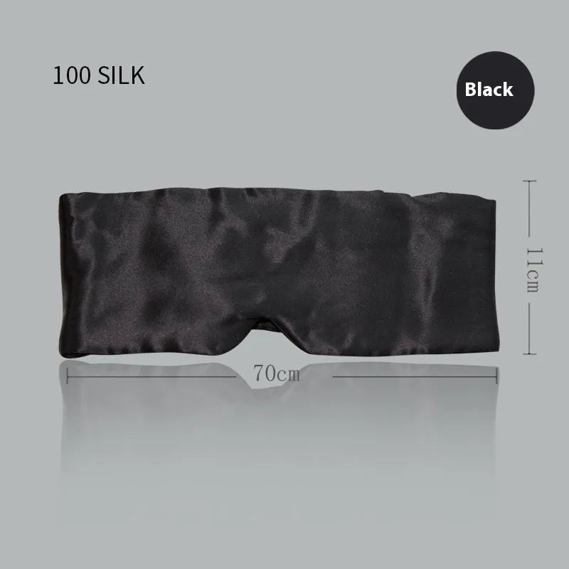 Mulberry silk sleep eye mask shown in champagne gold colour, laid flat on a surface.