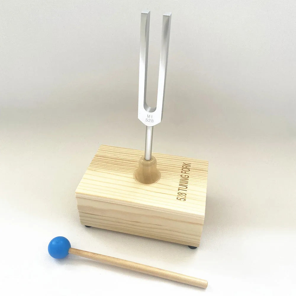 Aluminium alloy 432Hz tuning fork with acoustic speaker on kraft paper background