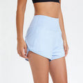 Women's high-waist nylon fitness shorts in black, white, and water blue colours