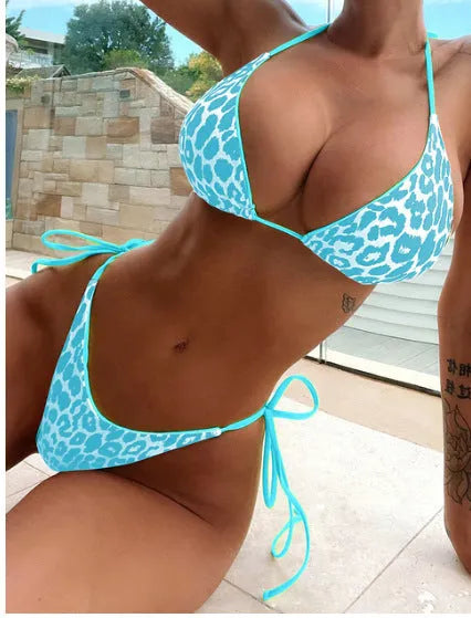 Women's lace-up front triangle bikini top with split bottoms in polyester fabric.