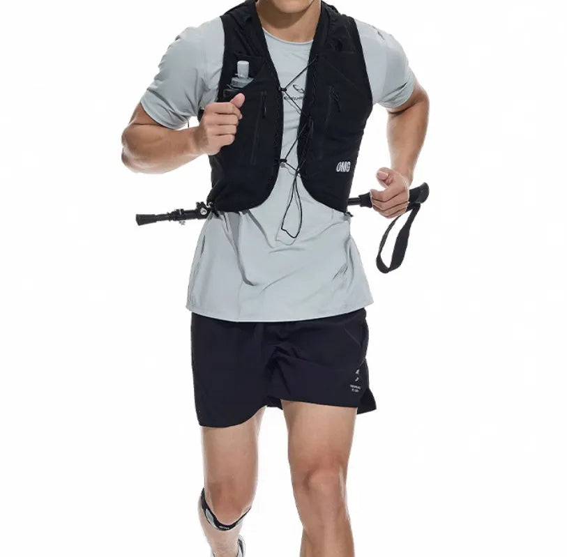 Men's black running shorts with laser stitching on a grey background, showing stretch fabric.