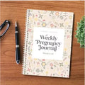 A5 Pregnancy Weekly diary notebook open on a weekly spread