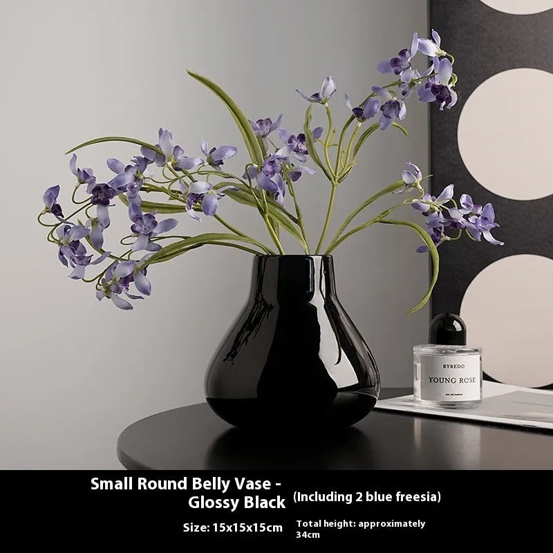 Ceramic decorative vase with orchid flowers in modern simplicity style