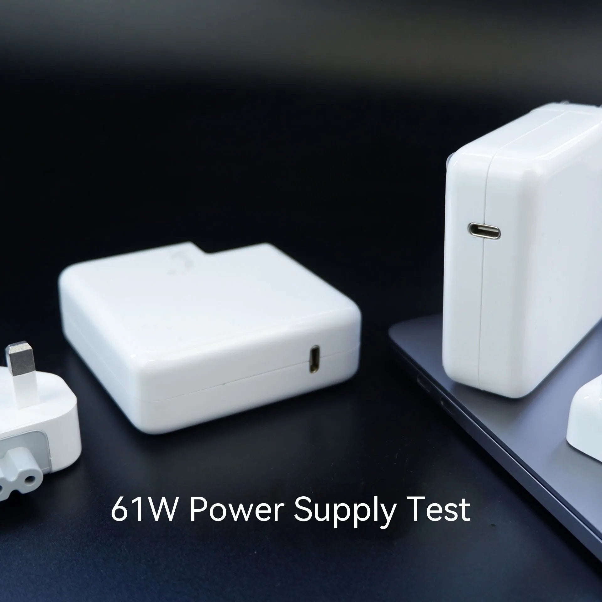 Compact 61W wireless laptop power adapter with UK plug and 2m USB-C cable, size 7x7x3cm