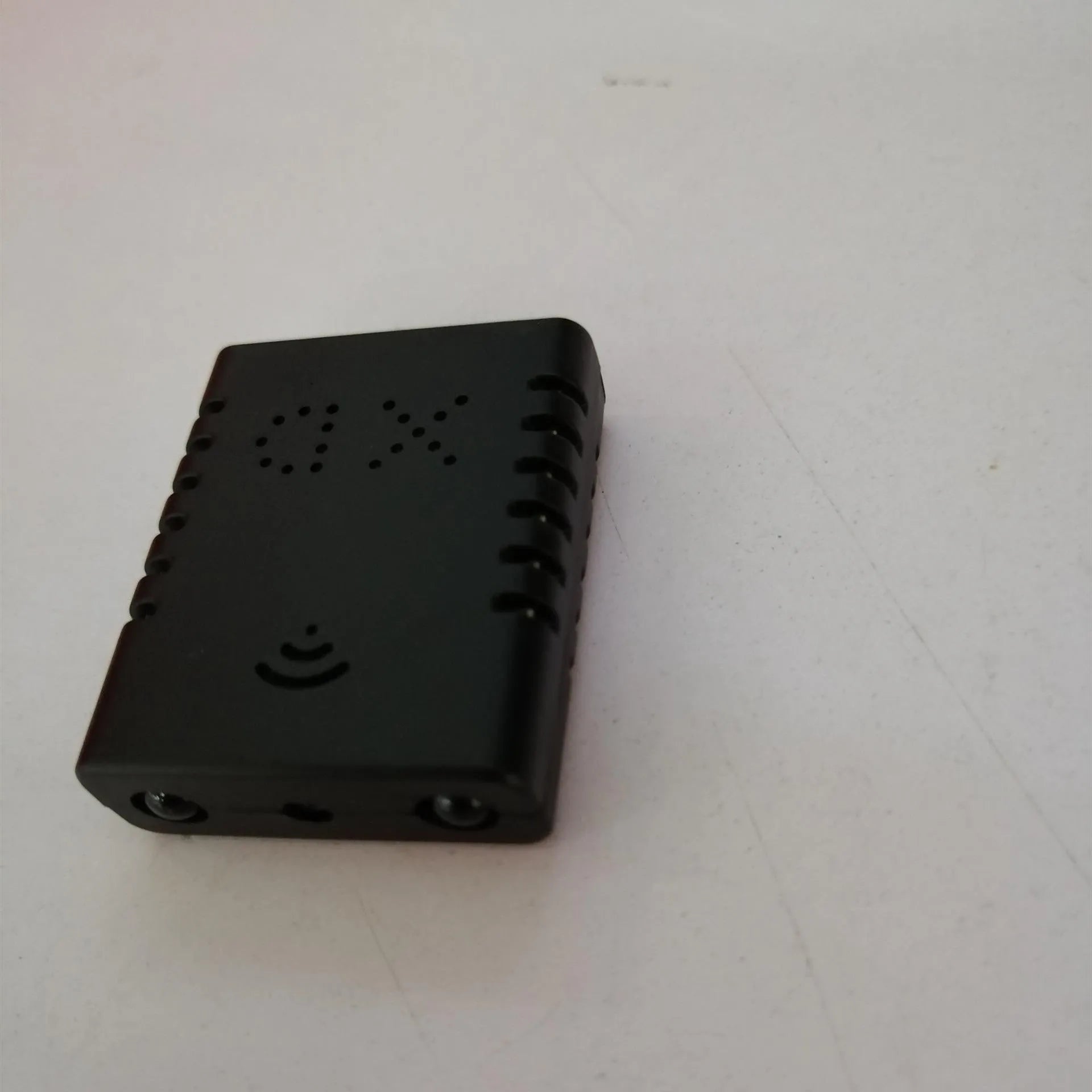 Mini Full HD 1080P night vision security camera in black, showing compact size and recording status