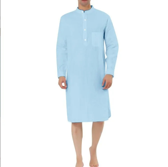Man wearing a light blue cotton shirt-style robe with front pockets, showcasing casual loungewear.