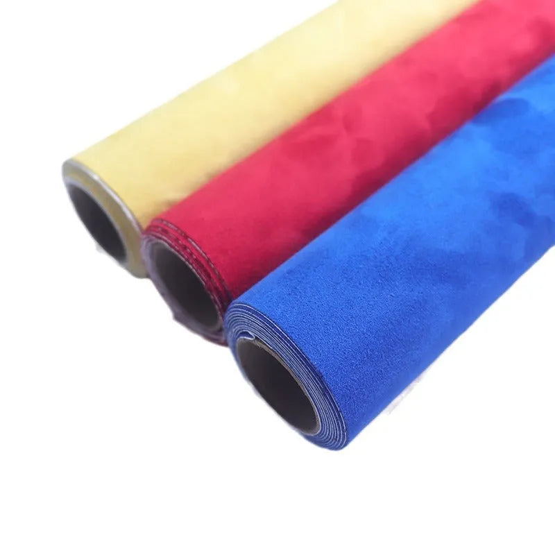 Rolls and sheets of coloured self-adhesive suede leather material for DIY projects.