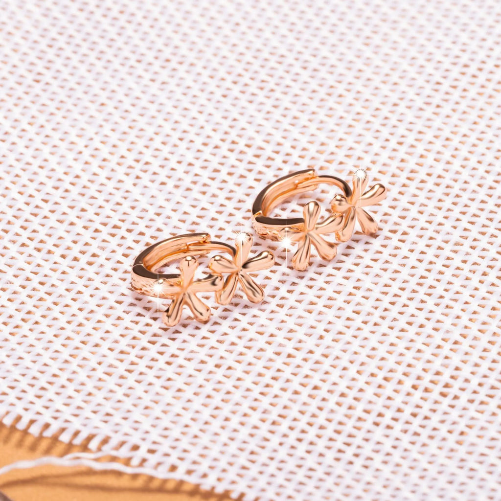 Rose gold circular earrings with a waterdrop flower design for women.