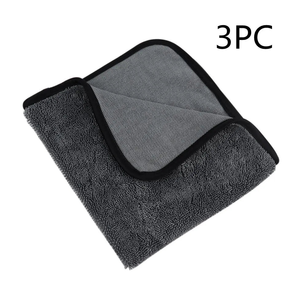 Grey square microfiber car wash towel for drying vehicles.