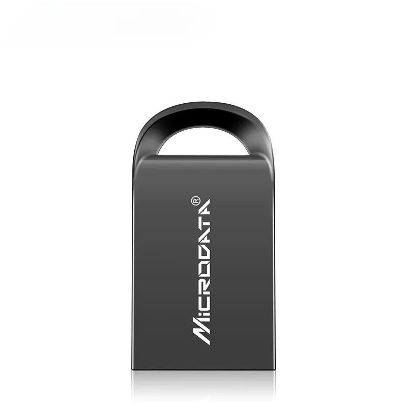 Silver car-shaped metal USB flash drive on a chain, shown next to a laptop.