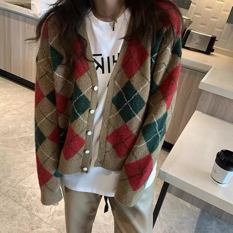 Casual knitted cardigan in acrylic fabric shown in a macaron colour palette on a hanger.