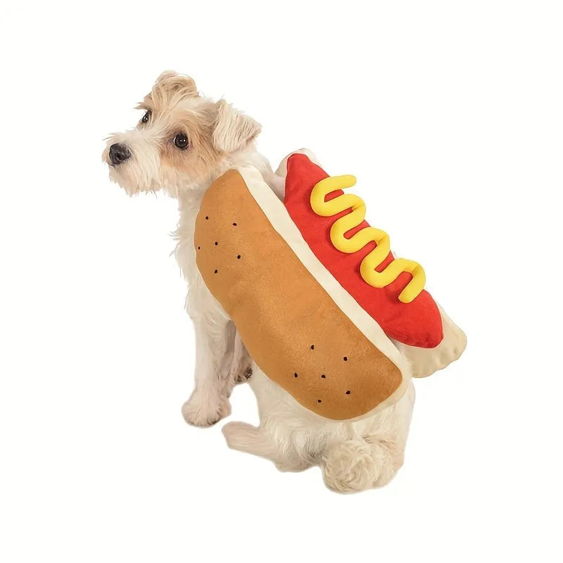 A dog or cat wearing a stuffed brown hot dog costume with bun detail for party cosplay.