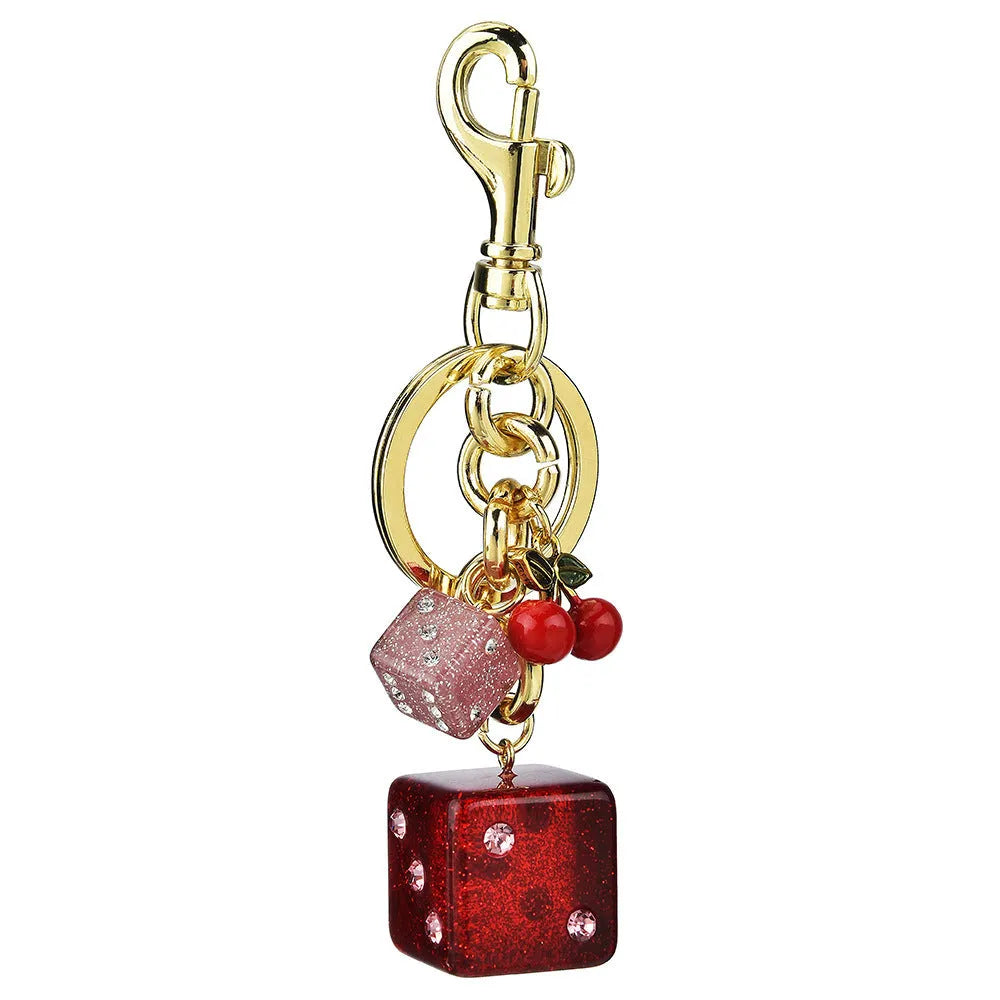 Square metal keychain pendant with cherry two-tone dice design and electroplated finish