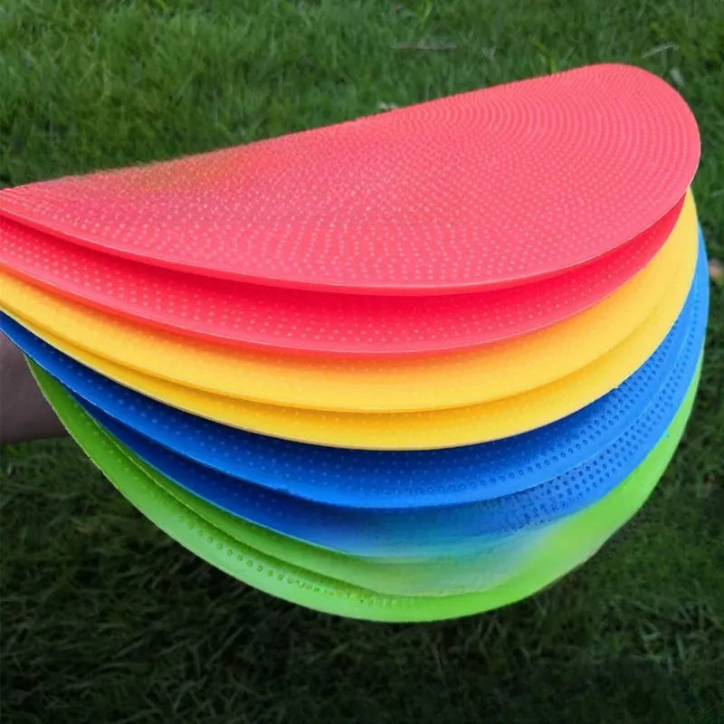 Soft yellow football landmark pad disc on grass, 23cm diameter, for training targets.