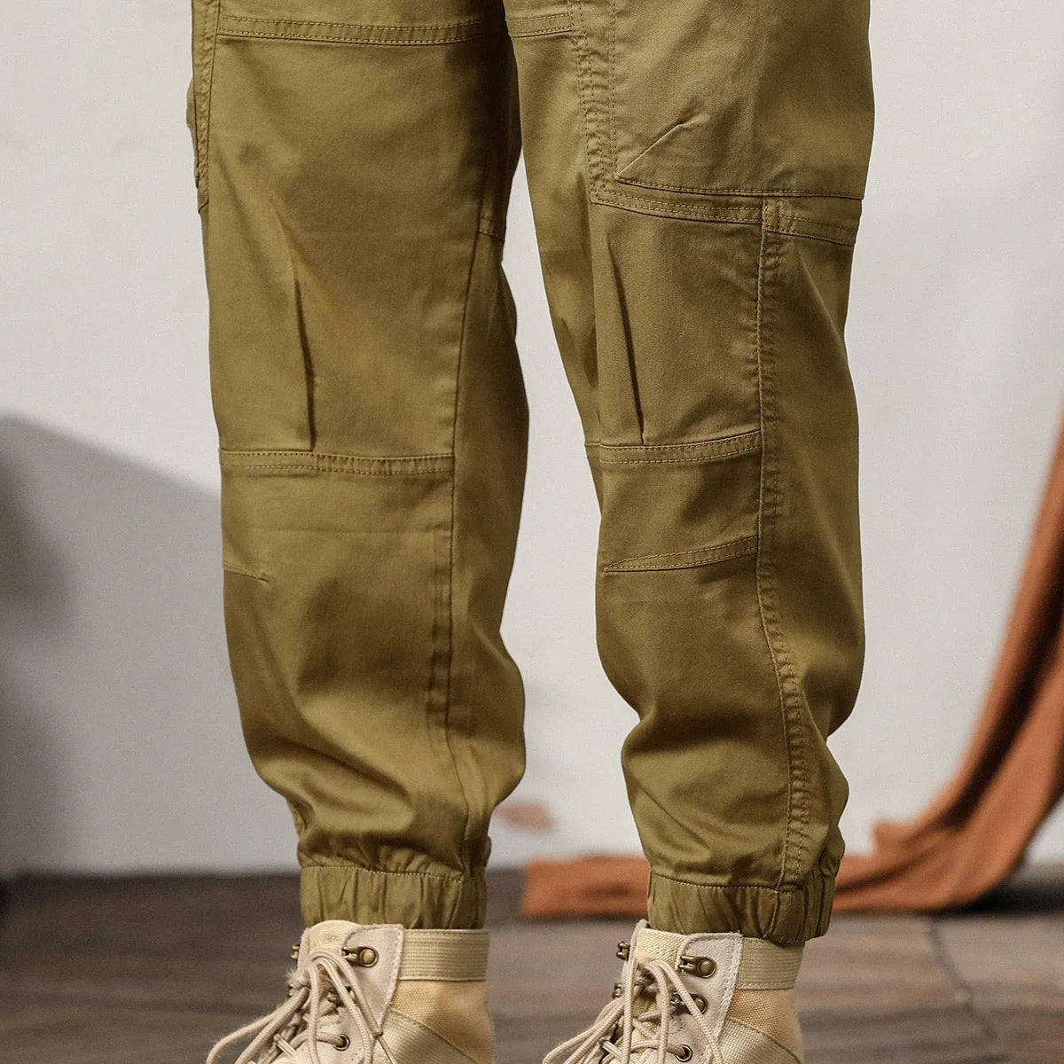 Men's Korean style tapered harem pants in cotton with small leg opening and mid-waist design