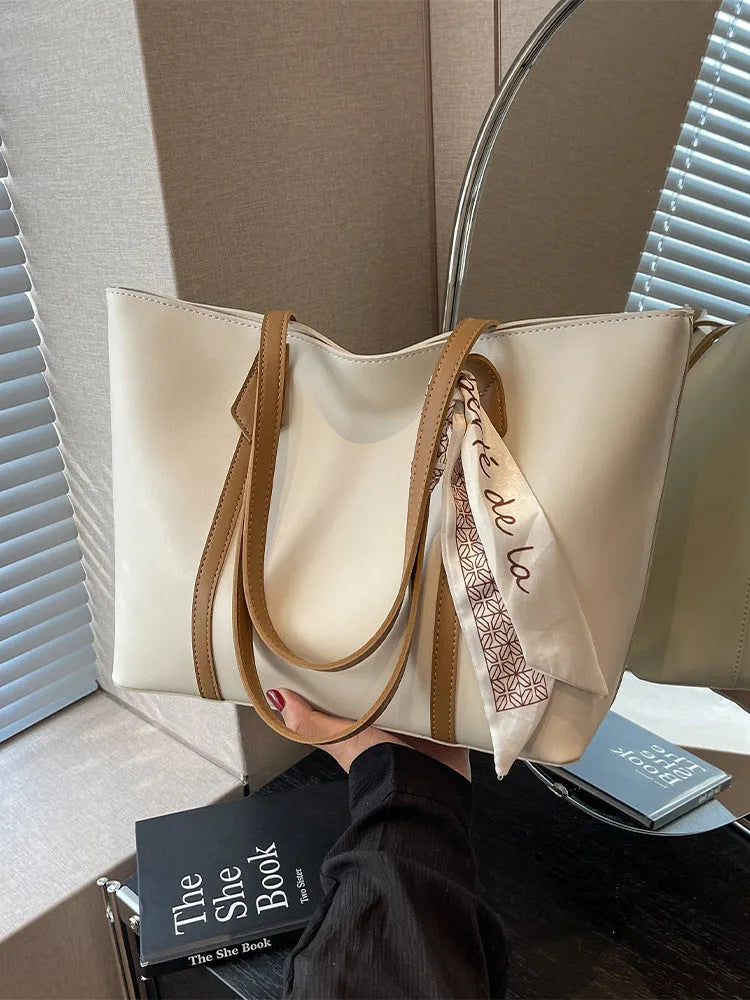 Canvas bucket tote bag with crossbody strap showing sandwich pocket organisation and soft construction