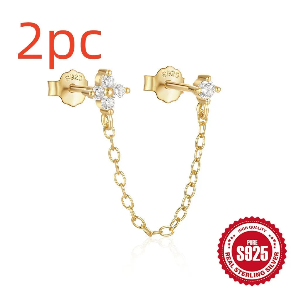 S925 sterling silver stud earrings with a floral motif and dangling gold-coloured tassel chain.
