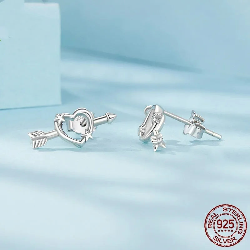 S925 sterling silver mini heart stud earrings with polished finish on white background