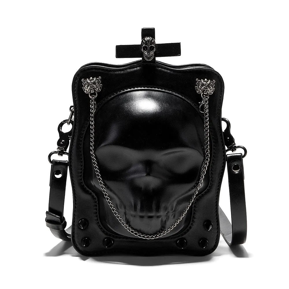 Black Gothic skull crossbody bag with embossed design, square shape, and chain detailing