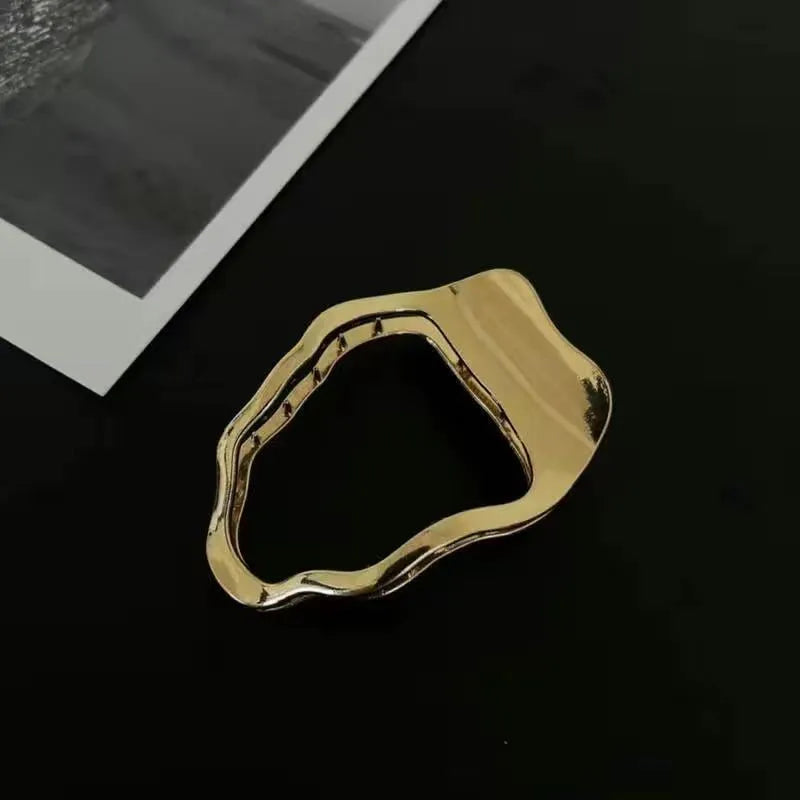 Gold and silver zinc alloy hair clip barrettes in arc, square, and triangle shapes.
