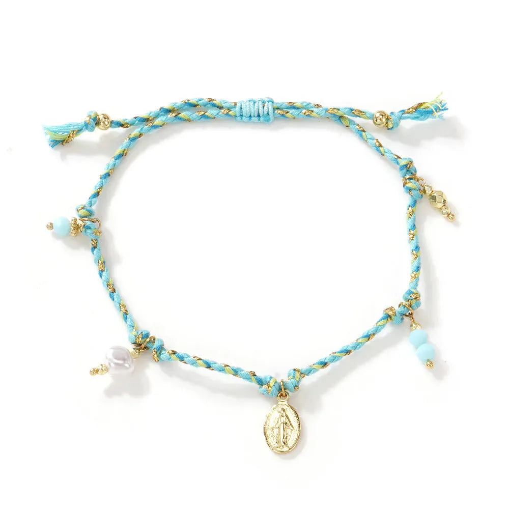 Hand-woven women's bracelet made from colourful braided rope with an integrated carrying strap tag design.