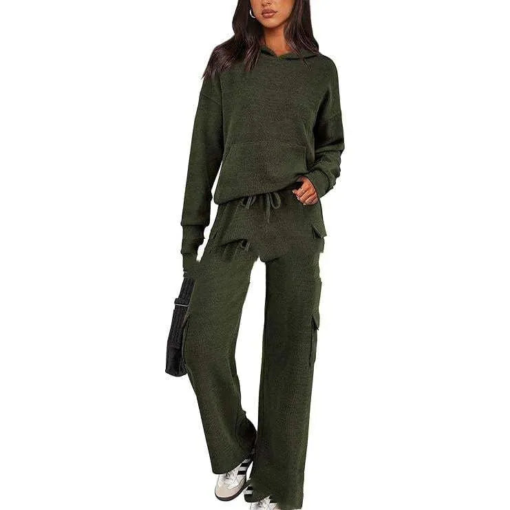 Women's black polyester leisure sports suit set with long sleeves and trousers laid flat.