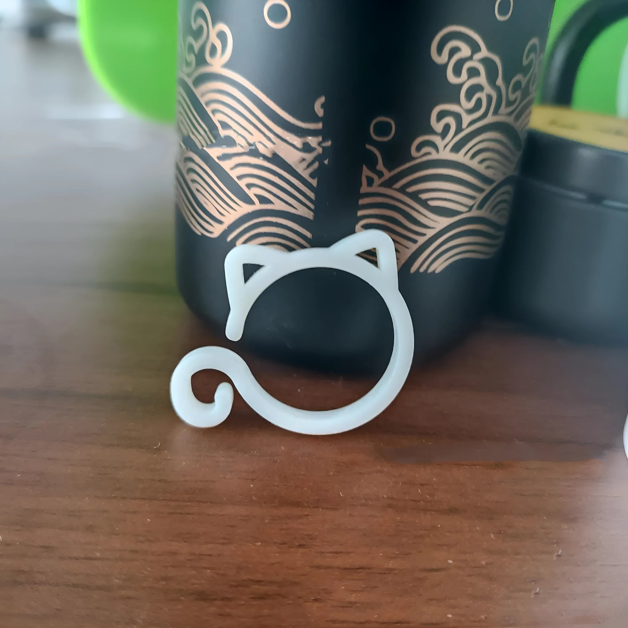 Cat-shaped plastic plant clip in green, red, white, and yellow colour options
